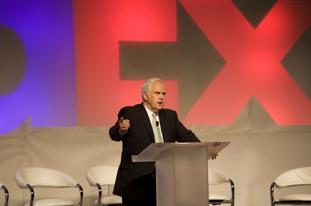 Man standing in front of a podium